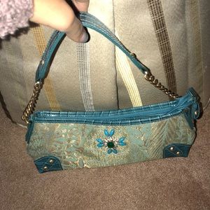 Blue pocketbook with stones